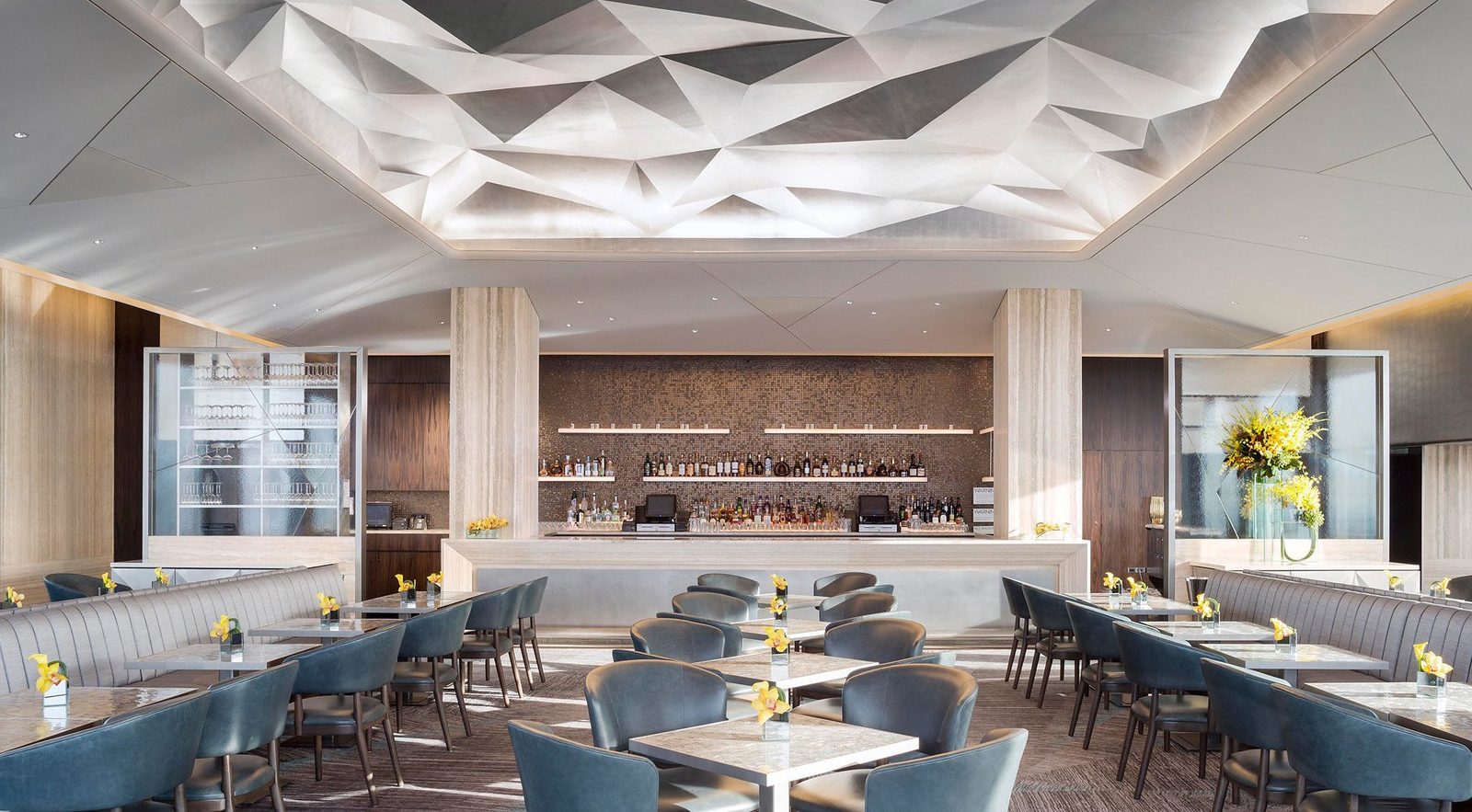 Residents' lounge with a sculpted timber ceiling and bespoke seating