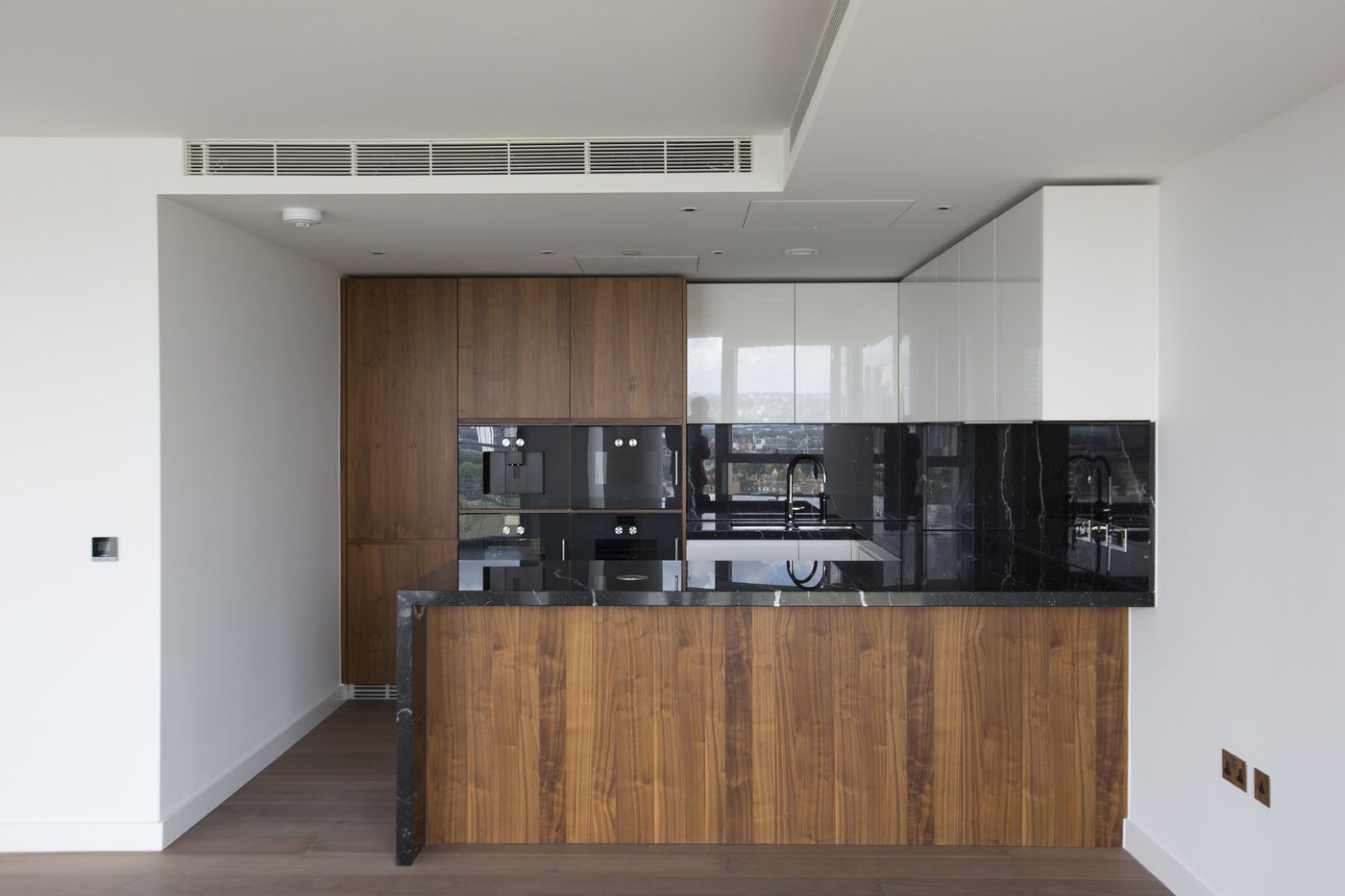Residential kitchen with a timber island and integrated appliances
